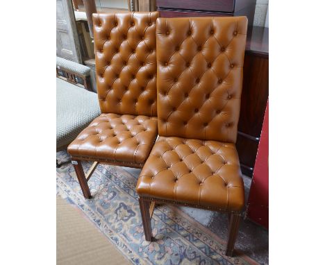 Pair of button back leather dining chairs