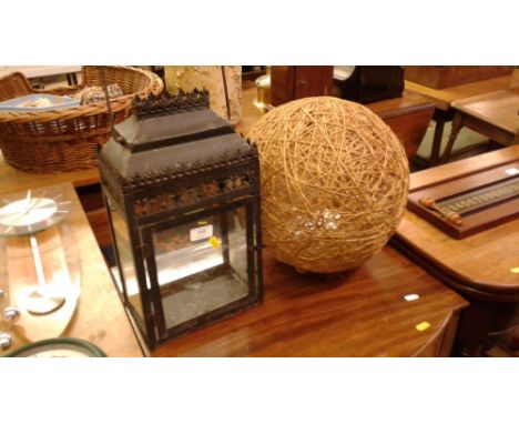 A metal lantern; and a light shade