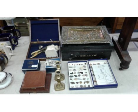 A pair of Victorian brass candlesticks; boxed cutlery; Royal Worcester egg coddlers; a brass embossed plaque; a tin; and a qu