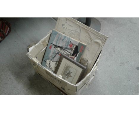 A box containing a hunting print; various embroideries; a gilt framed print of a country house; picture frames etc. 