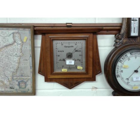 A walnut cased barometer 