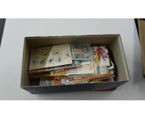 An accumulation of dealers stamp packets, good for thematics in shoe box 