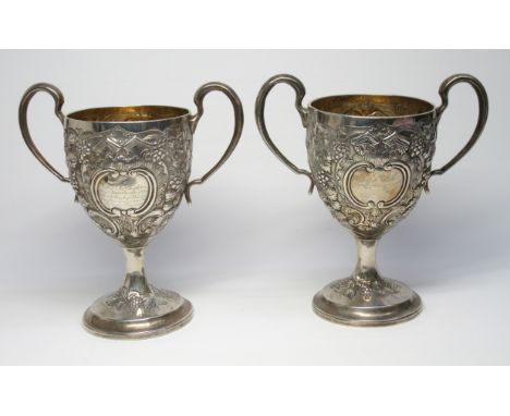 A PAIR OF FINE GEORGE III IRISH SILVER TWIN HANDLED PRESENTATION GOBLETS EACH WITH TWO FOLIATE SCROLL CARTOUCHES INSCRIBED ' 