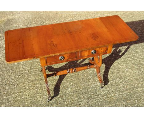 YEWWOOD SOFA TABLE, TWO DRAWERS AND TWO DUMMY DRAWERS ON LYRE SUPPORTS, FOUR SPLAYED LEGS ON CLAW CASTORS (56 CM, 64.5 CM(EXT