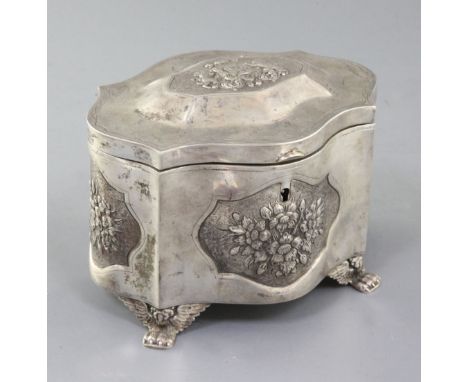 JUDAICA: A mid 19th century Polish 84 zolotnik silver etrog box, of serpentine form, with embossed floral panels and lid deco