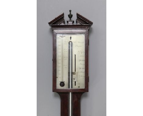 An early 19th century mahogany stick barometer, by William Wright of Ongar, with silvered scale and domed cistern cover, 3ft 