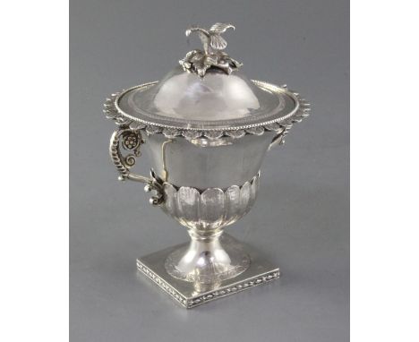 An early 19th century Italian silver two handled vase and cover, with bird finial and ornate scroll handles, 15.5cm, 13 oz.