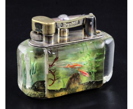 A Dunhill aquarium desk lighter, decorated with five fish in a tank, signed, width 3.75in. height 3in.