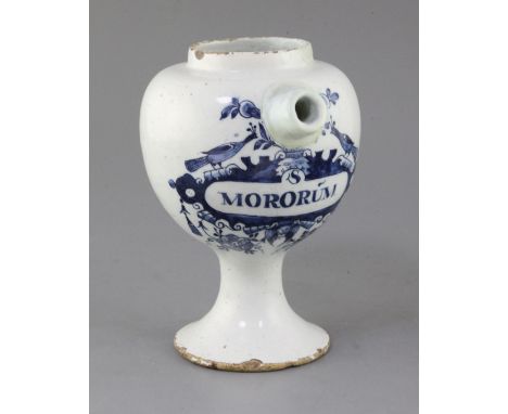 An English delftware blue and white wet drug jar, c.1690-1700, painted with the title MORORUM in a cherub head and peacock ca