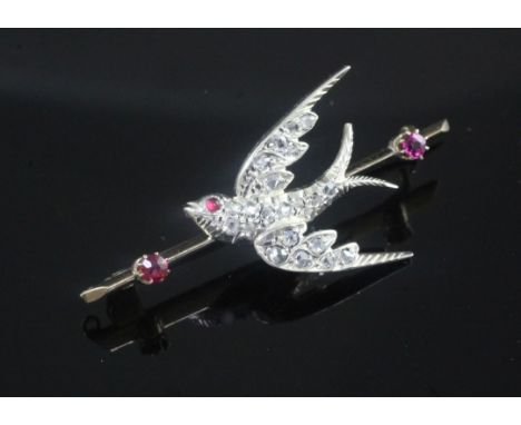 A Victorian style gold, ruby and rose cut diamond set swallow brooch, 45mm.