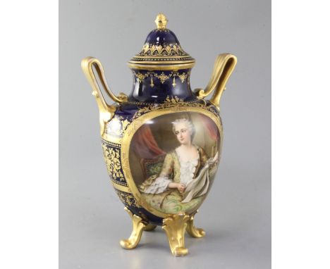 A Vienna style twin handled vase and cover, c.1910, painted with a portrait of an aristocratic lady reading, signed Wagner ag