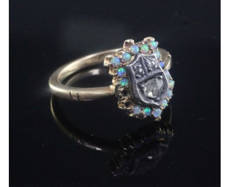 An Edwardian 18ct gold, white opal and rose cut diamond set shield shaped ring, missing two opals, size L.