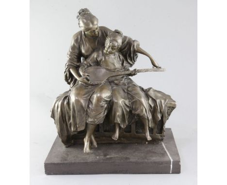 Milo. A bronze group of a mother and child playing a mandolin, signed, on marble plinth, height 17.5in.