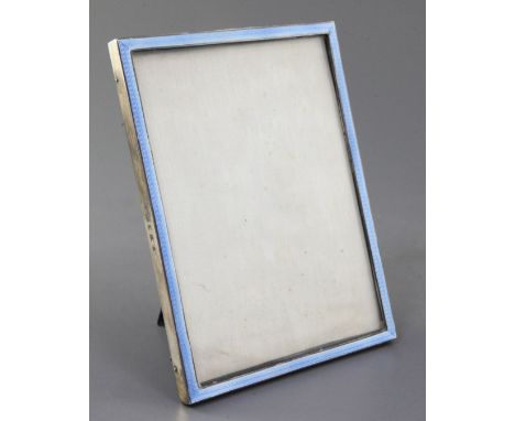 An early 1930's silver and blue guilloche enamel mounted rectangular photograph frame by William Comyns & Sons Ltd, London, 1