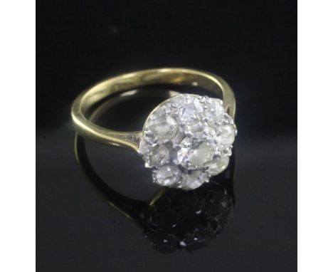 A gold and nine stone diamond cluster ring, size K.