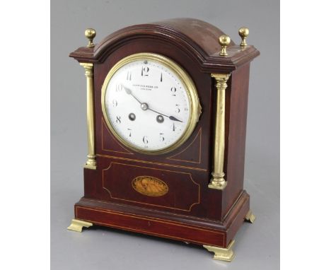 An Edwardian Mappin & Webb brass mounted mahogany mantel clock, with enamelled Roman dial and S. Marti movement, 11.5in.