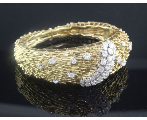 An 18ct yellow gold and diamond hinged bangle, of rod and sphere design, set with forty two stones, maker, CJ Ltd, gross weig