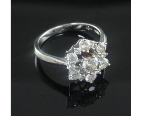 A modern 18ct white gold and diamond cluster ring, size M.