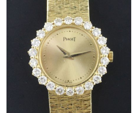 A lady's 1980's 18ct gold and diamond Piaget manual wind wrist watch, the dial with dot markers and bezel set with twenty two