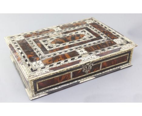 An 18th century Indo-Portuguese ivory, ebony and tortoiseshell games box, with trays of assorted gaming counters including iv