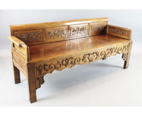 A Chinese hardwood bench, 19th century, inset with floral carved panels, W.6ft 2in. D.2ft H.2ft 8in.