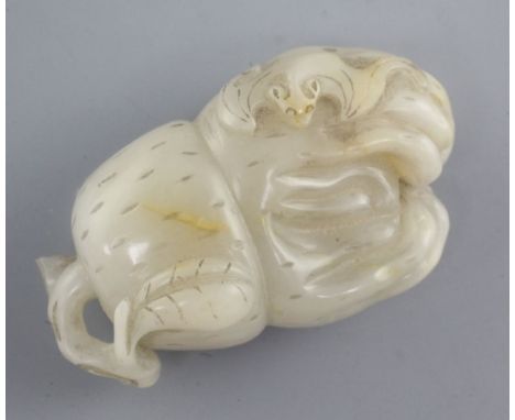 A Chinese pale grey and russet jade carving of a finger citron, carved in relief with a bat, 6.8cm