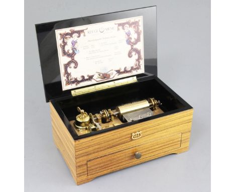 A Reuge of Switzerland musical box, with five interchangeable cylinders playing ten airs, numbered C2103, 10.25in.