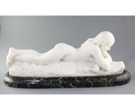 Charles R. Faggioni (19th/20th century). A white marble carving of a nude woman reclining reading a book, signed, on green ma