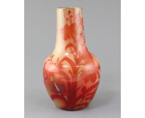 A French art pottery lustre vase, in the manner of Leon Castel, late 19th century, decorated in ruby and silver lustre with a