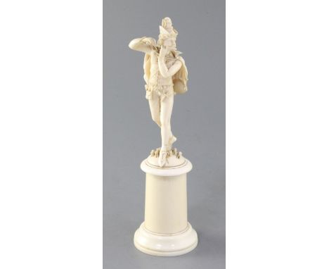 A 19th century French Dieppe ivory carving of The Pied Piper, on cylindrical socle, height 8.5in.