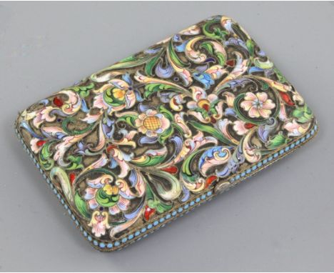 A late 19th/early 20th century Russian 84 zolotnik silver gilt and champleve enamel cigarette case, decorated with foliate sc