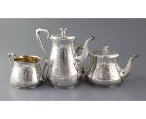 A Victorian silver three piece tea/coffee set by Daniel & Charles Houle, comprising, teapot, coffee pot and sugar bowl, of ta