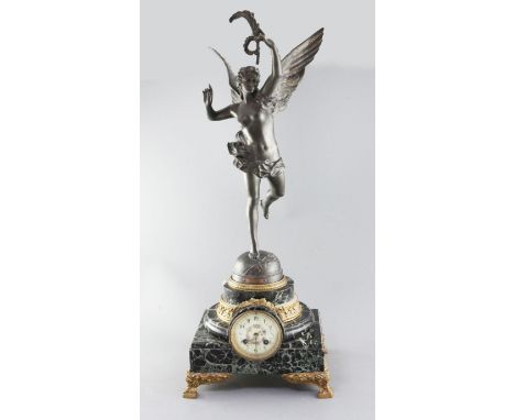 An early 20th century French bronzed spelter and green marble mantel clock, surmounted with a figure of Gloria after Bareau, 
