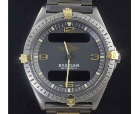 A gentleman's Breitling Aerospace titanium quartz wristwatch, with digital and analogue blue dial, no. 80360, with original b