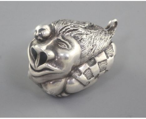 A Japonaise silver miniature netsuke style figural group of a stylised lion with figure, unmarked, 45mm.