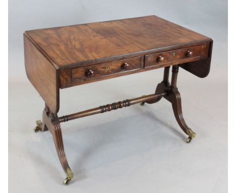 A Regency mahogany sofa table, with twin end columns and fluted downswept legs, W.3ft 2in. D.2ft H.2ft 5in.