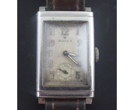 A gentleman's 1930's stainless steel Rolex manual wind wrist watch, with rectangular Arabic dial and subsidiary seconds, the 