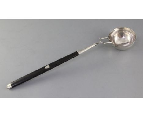 An early 19th century Italian 800 standard silver punch ladle, with ebonised handle, maker's mark FG?, 47.5cm
