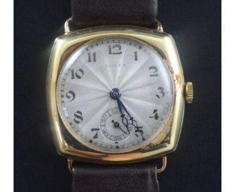 A gentleman's 1920's 18ct gold Rolex manual wind wrist watch, with shaped square case and Arabic silvered sunburst dial with 