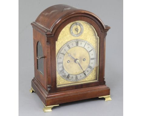An Edwardian mahogany small bracket clock, with arched mahogany case, silvered and parcel gilt brass dial and twin fusee move
