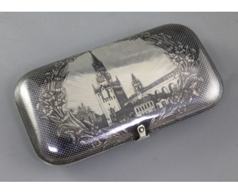 A 19th century Russian silver and niello work cheroot case, decorated with the Kremlin Spasskaya Clock Tower, assay master B.