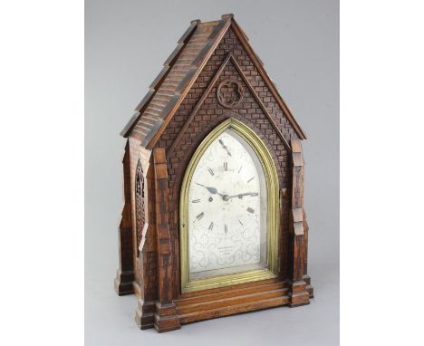 Carrew & Rule, Fenchurch Street, London. A Victorian Gothic design oak hour repeating bracket clock, modelled as a church fro