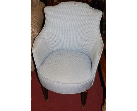 A late Victorian mahogany framed and reupholstered tub chair, raised on tapering supports, together with a matching Victorian