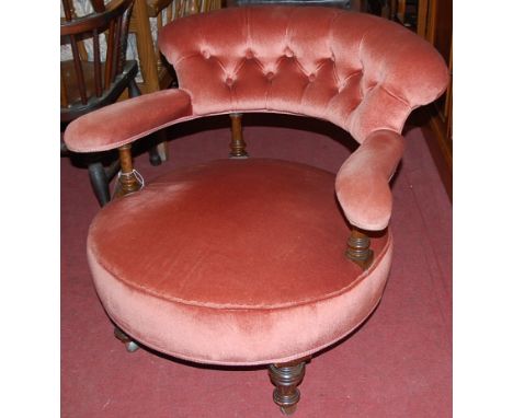 A mid Victorian mahogany framed pink button back upholstered tub armchair, together with a further similar Victorian mahogany
