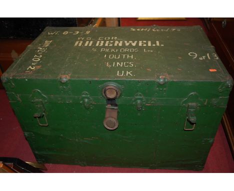 A painted metal and annotated travel trunk; one other metal example; and a canvas bound trunk (3)  