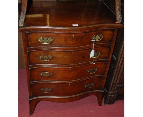 A Georgian style walnut and crossbanded serpentine front chest of four long drawers, raised on splayed bracket supports, earl