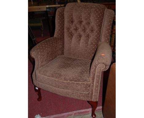A set of three contemporary floral button back wing armchairs, each raised on cabriole forelegs, width 83cm
