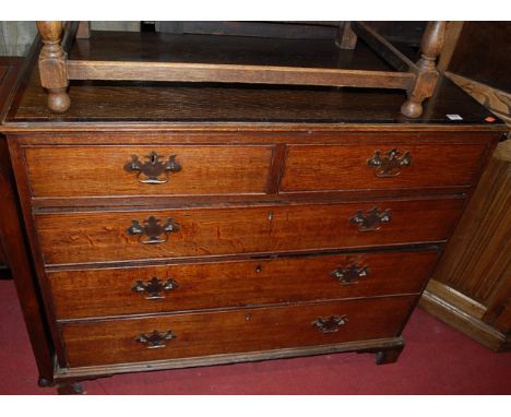 An early 19th century oak and crossbanded squarefront chest of two short over three long graduated drawers, on bracket suppor