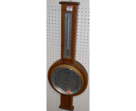 An Edwardian mahogany and inlaid aneroid two-dial wheel barometer, signed A Hawes & Son, Croydon, height 72.5cm