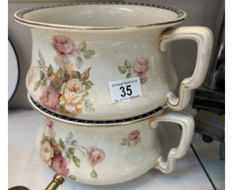A matching pair of Edwardian rose pattern ceramic chamber pots / planters